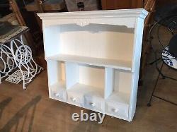 A very large country pine wall unit with drawers & shelves painted white