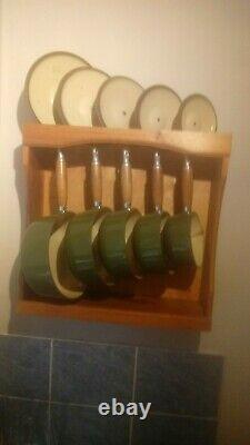 Le creuset green 5 piece pan set with wall mounted le creuset pan rack