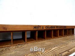 Retro industrial Moet Chandon branded 10 hole wall mounted wine rack