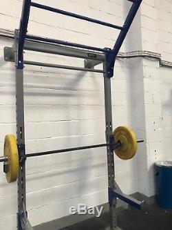 Squat rack, floor and wall mounted with safety bars, for gym