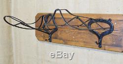 Vintage double saddle rack, side saddle & astride, cast iron on wooden wall mount