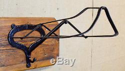 Vintage double saddle rack, side saddle & astride, cast iron on wooden wall mount