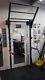 WALL MOUNTED SQUAT RACK (space saving) with extras. Tiered pull up bar etc
